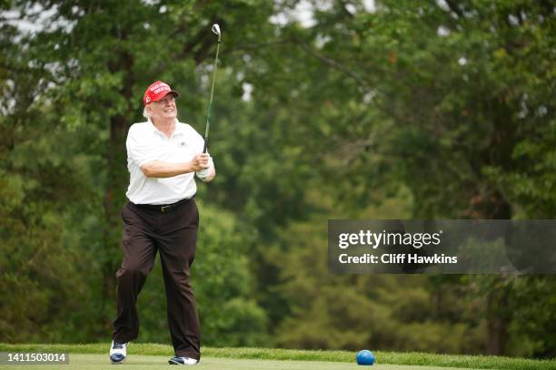 Former U.S. President Donald Trump plays his shot from the 14th tee during the pro-am prior to the LIV Golf Invitational - Bedminster at Trump...