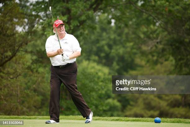 Former U.S. President Donald Trump plays his shot from the 14th tee during the pro-am prior to the LIV Golf Invitational - Bedminster at Trump...