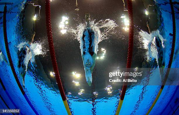 Martina Granstroem of Sweden, Ellen Gandy of Beckenham Swim Club, and Ida Varga Marko of Sweden swim heat 7 of the Womens 200m Butterfly during day...