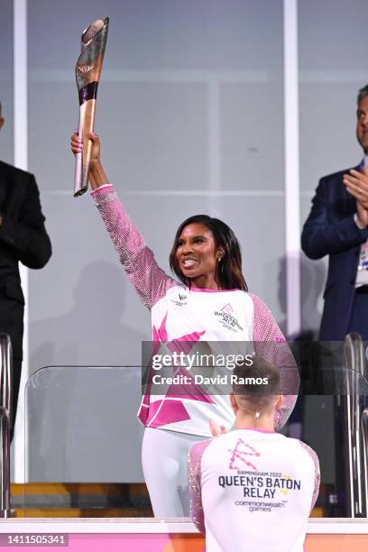 Denise Lewis carries the Queen’s Baton during the Opening Ceremony of the Birmingham 2022 Commonwealth Games at Alexander Stadium on July 28, 2022 on...