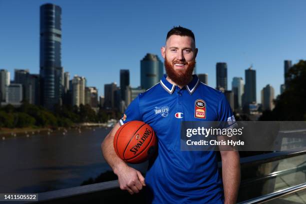 Aaron Baynes poses after signing with NBL team the Brisbane Bullets on a two year deal, at Kangaroos Point on July 29, 2022 in Brisbane, Australia.