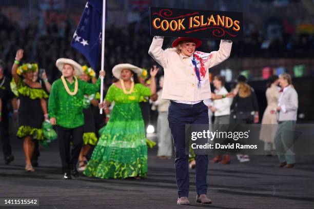 Games volunteer holds up a 'Cook Islands' sign during the Opening Ceremony of the Birmingham 2022 Commonwealth Games at Alexander Stadium on July 28,...