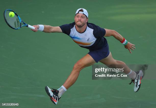 James Duckworth of Australia returns a forehand to Alex de Minaur of Australia during the Atlanta Open at Atlantic Station on July 28, 2022 in...