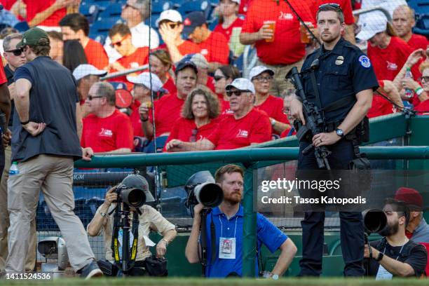 Capitol Police officer stands guard at the dugouts during the Congressional Baseball Game for Charity at Nationals Park July 28, 2022 at Nationals...