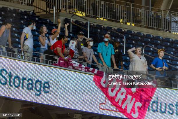 Protesters un-veil a sign at the Congressional Baseball Game for Charity at Nationals Park July 28, 2022 at Nationals Park in Washington, DC. The...