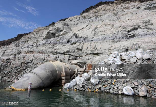 Water intake pipe is shown above the water line at Saddle Island on July 28, 2022 in the Lake Mead National Recreation Area, Nevada. The top of...