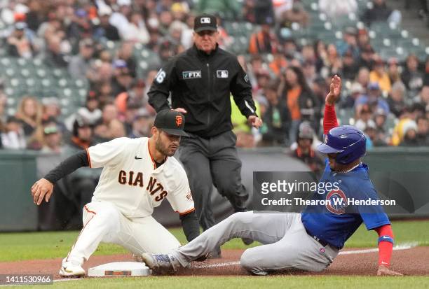 Christopher Morel of the Chicago Cubs attempting to steal third base gets caught tagged out by David Villar of the San Francisco Giants in the top of...