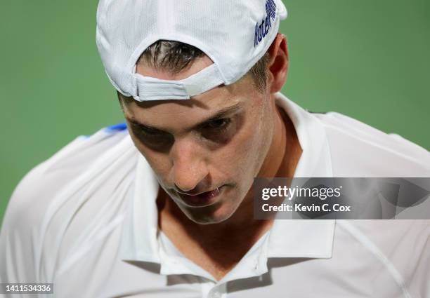 John Isner reacts during his match against Ben Shelton in a first set tie-breaker during the Atlanta Open at Atlantic Station on July 28, 2022 in...