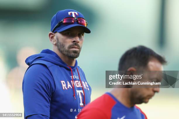 Manager Chris Woodward of the Texas Rangers looks on during the game against the Oakland Athletics at RingCentral Coliseum on July 23, 2022 in...