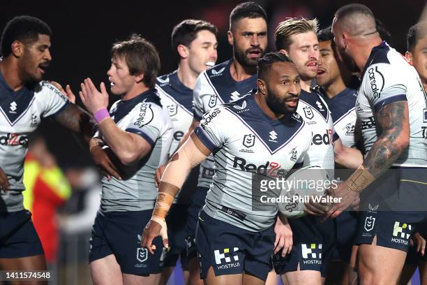 Justin Olam of the Storm celebrates scoring a try during the round 20 NRL match between the New Zealand Warriors and the Melbourne Storm at Mt Smart...
