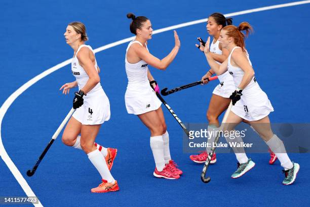 Alia Jaques of Team New Zealand celebrates with team mate Kaitlin Cotter after scoring their sides first goal during Women's Hockey - Women's Pool B...
