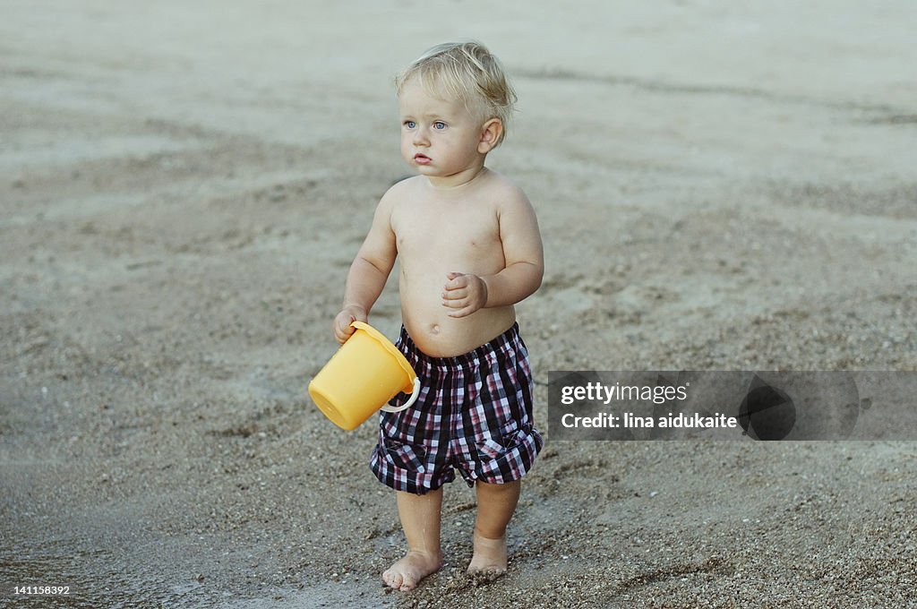 Toddler with bucket