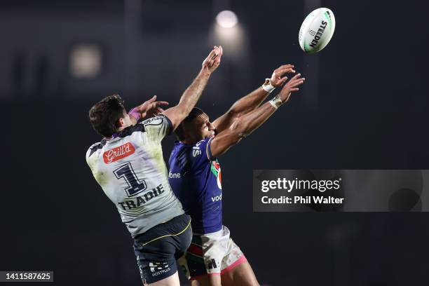 Marcelo Montoya of the Warriors and Nick Meaney of the Storm compete for the ball during the round 20 NRL match between the New Zealand Warriors and...