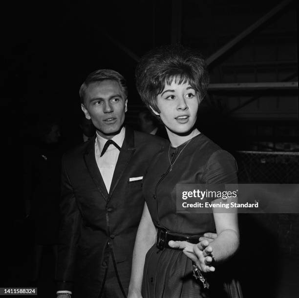 British singer and actor Adam Faith , wearing a suit with an under collar bow tie, and British singer and actress Helen Shapiro, wearing a...