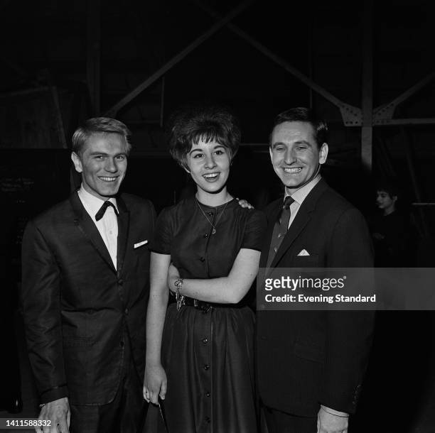 British singer and actor Adam Faith , wearing a suit with an under collar bow tie, with British singer and actress Helen Shapiro, wearing a...