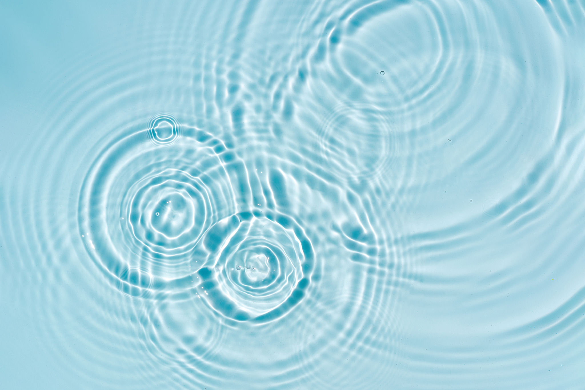 Blue water texture, blue mint water surface with rings and ripples. Spa concept background Blue water texture, blue mint water surface with rings and ripples. Spa concept background