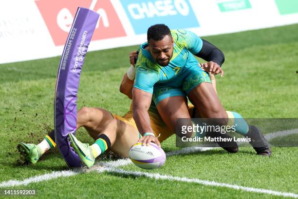 Samu Kerevi of Team Australia scores a try during the Men's Rugby Sevens Pool D match between Team Australia and Team Jamaica on day one of the...