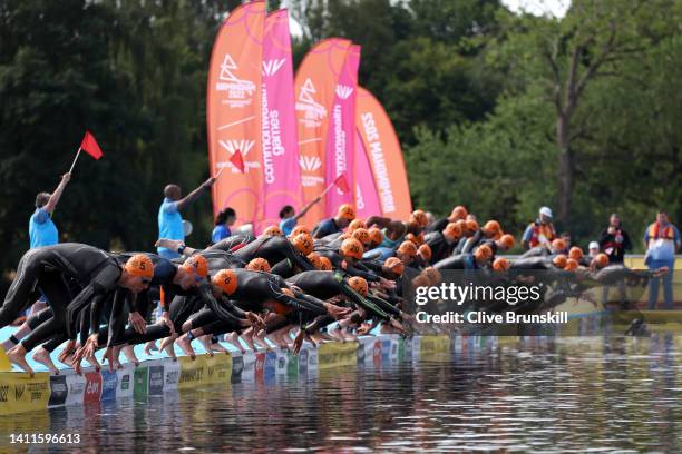 Athletes dive in to start the Men's Individual Sprint Distance Triathlon Final on day one of the Birmingham 2022 Commonwealth Games at Sutton Park on...