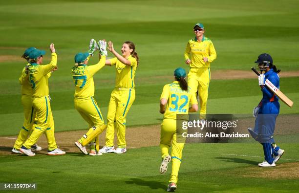 Darcie Brown of Team Australia celebrates the wicket of Smriti Mandhana of Team India with Alyssa Healy during the Cricket T20 Preliminary Round...