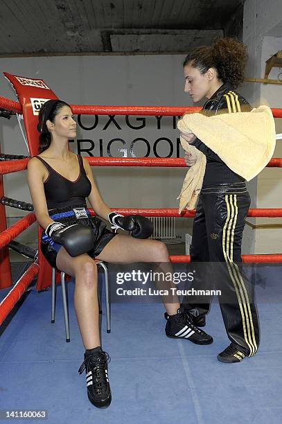 Model Micaela Schaefer and Susi Kentikian train for a tv celebrity boxing show at the Box Gym Koepenick on March 11, 2012 in Berlin, Germany.