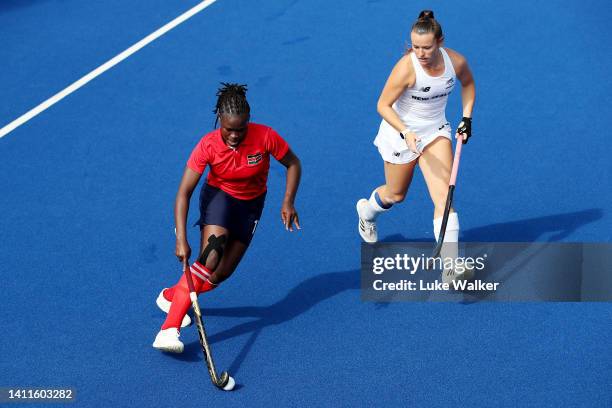 Flavia Mutiva of Team Kenya competes with Rose Tynan of Team New Zealand during Women's Hockey - Women's Pool B on day one of the Birmingham 2022...