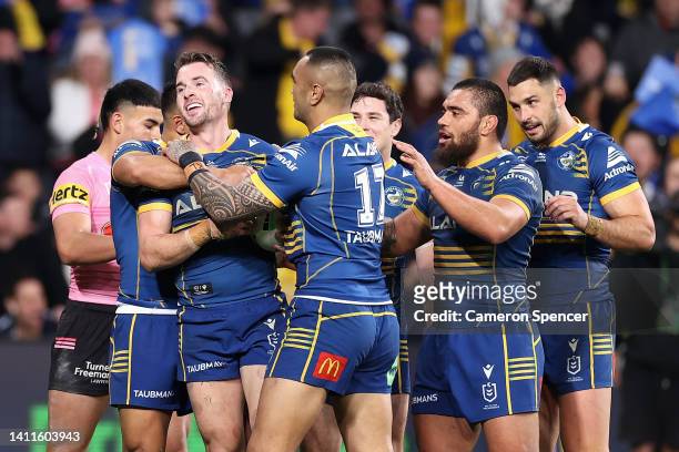 Clinton Gutherson of the Eels celebrates scoring a try with team mates during the round 20 NRL match between the Parramatta Eels and the Penrith...