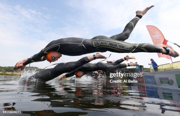 Samuel Dickinson of Team England dives in to start the Men's Individual Sprint Distance Triathlon Final on day one of the Birmingham 2022...