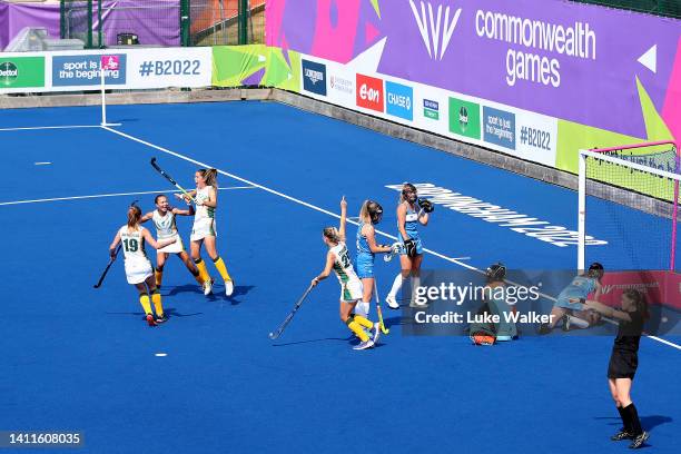 Lisa-Marie Deetlefs of Team South Africa celebrates with team mates after scoring their sides first goal during Women's Hockey - Women's Pool B match...