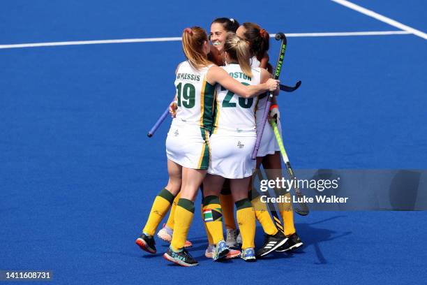 Lilian du Plessis of Team South Africa celebrates with team mates after scoring their sides second goal during Women's Hockey - Women's Pool B match...