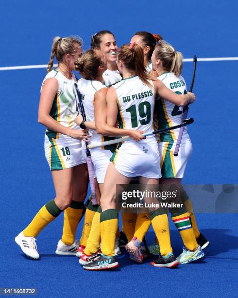 Lilian du Plessis of Team South Africa celebrates with team mates after scoring their sides second goal during Women's Hockey - Women's Pool B match...