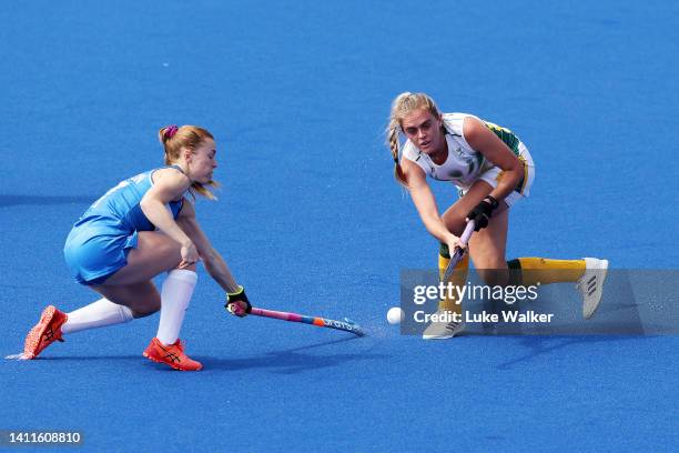 Sarah Jamieson of Team Scotland competes with Marizen Marais of Team South Africa during Women's Hockey - Women's Pool B match between South Africa...