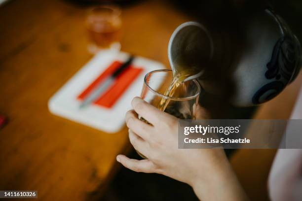 pouring cider in a glas - apfelweinglas stock pictures, royalty-free photos & images