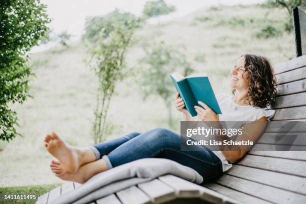 Spring Reading Outside Woman Reading Book Spring Photos and Premium High Res Pictures - Getty ...