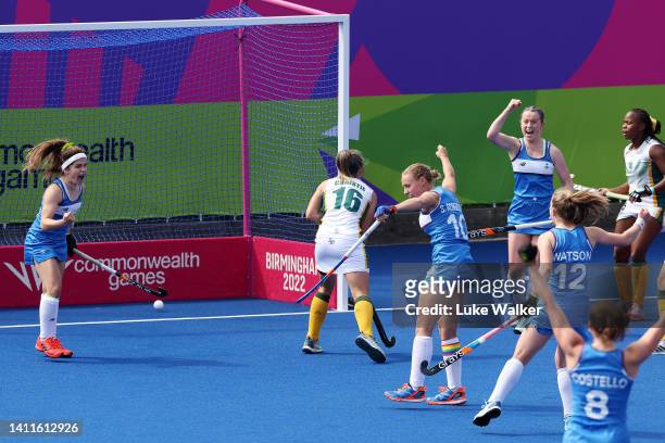 Sarah Robertson of Team Scotland celebrates with team mates after scoring their sides second goal during Women's Hockey - Women's Pool B match...