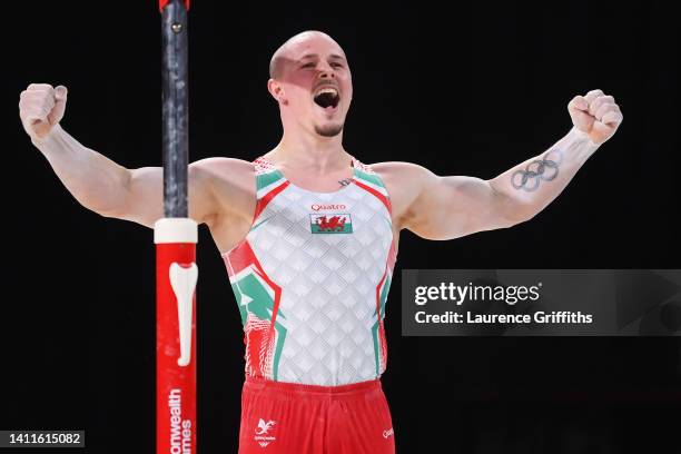 Brinn Bevan of Team Wales reacts after competing on the parallel bars during the Men's Team and Individual Artistic Gymnastic Qualification on day...