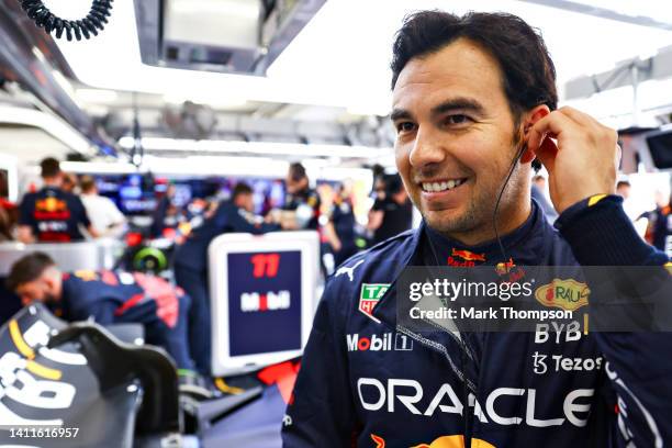 Sergio Perez of Mexico and Oracle Red Bull Racing prepares to drive in the garage during practice ahead of the F1 Grand Prix of Hungary at...