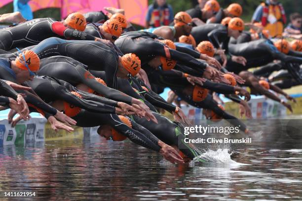 Athletes dive in to start the Men's Individual Sprint Distance Triathlon Final on day one of the Birmingham 2022 Commonwealth Games at Sutton Park on...