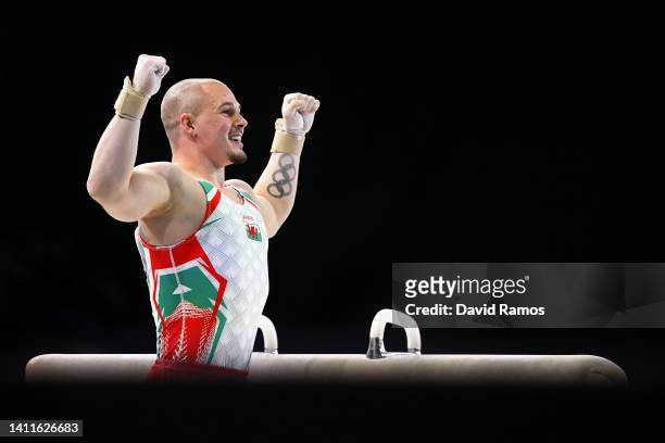 Brinn Bevan of Team Wales reacts after competing on the pommel horse during the Men's Team and Individual Artistic Gymnastic Qualification on day one...