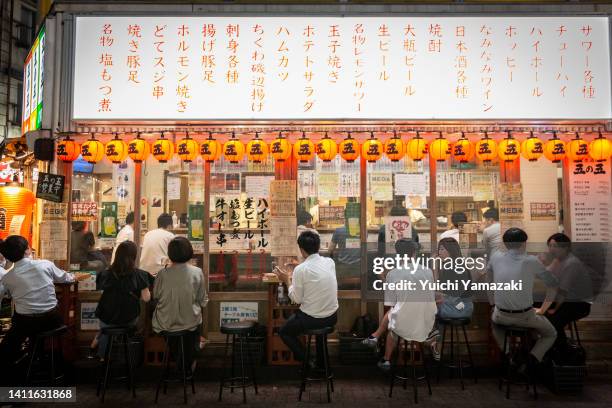 People enjoy drinks and foods at Japanese bar in Ueno area on July 29, 2022 in Tokyo, Japan. World Health Organization announced Japan's COVID-19...