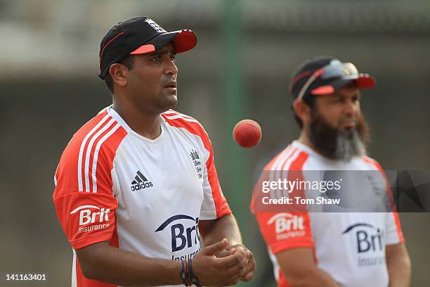 Samit Patel of England looks on with spin bowling coach Mushtaq Ahmed during the England nets session at the R. Premadasa Stadium on March 12, 2012...