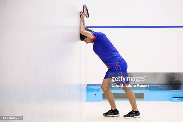 Jake Kelly of Team Cayman Islands reacts during Squash - Men's Singles Round of 64 match on day one of the Birmingham 2022 Commonwealth Games at...