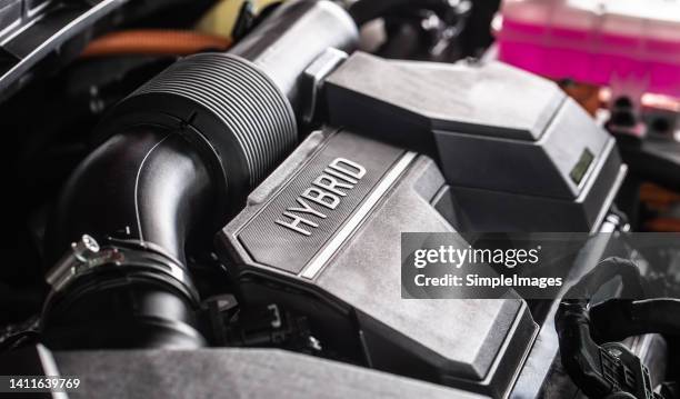 open hybrid car engine. electric and gasoline car engine. - hybrid car stockfoto's en -beelden