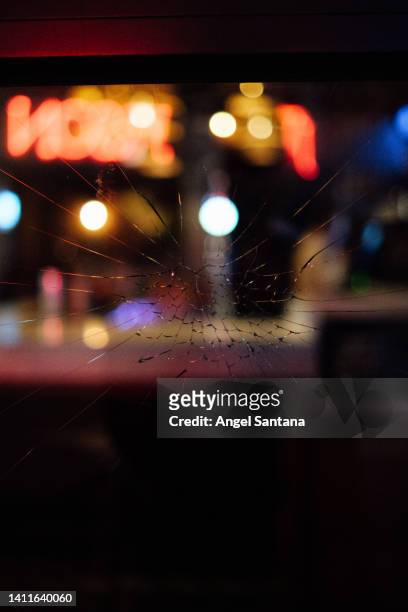 close-up of broken glass window at night - cracked windshield stock pictures, royalty-free photos & images