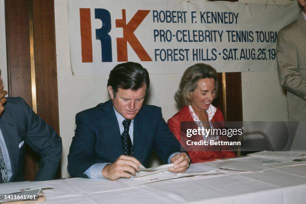 Edward Kennedy seated with Ethel Kennedy during press conference on RFK pro-celebrity tennis championships.
