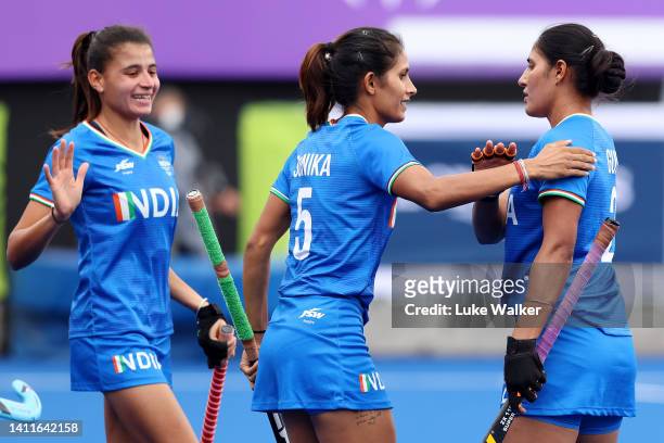 Deep Grace Ekka of Team India celebrates with team mate Sonika after scoring their sides first goal during the Women's Pool A match between India and...
