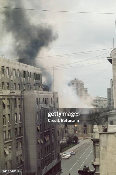 Presidential Palace, La Moneda, in flames as tanks fire at point blank range as it was bombed by jets as the three armed forces and national poloce...