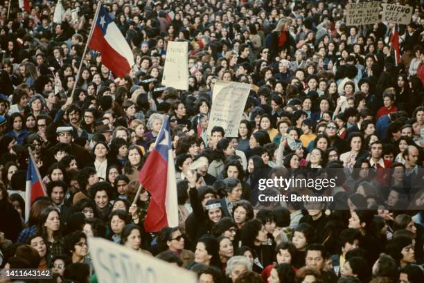 Women wave handkerchiefs as symbol of their opposition to the government of Chile's President Salvador Allende during a demonstration in Santiago in...