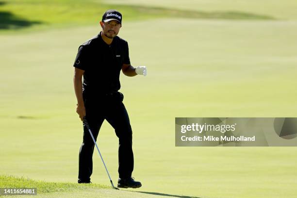 Satoshi Kodaira of Japan waves to the crowd on the 14th hole during the second round of the Rocket Mortgage Classic at Detroit Golf Club on July 29,...