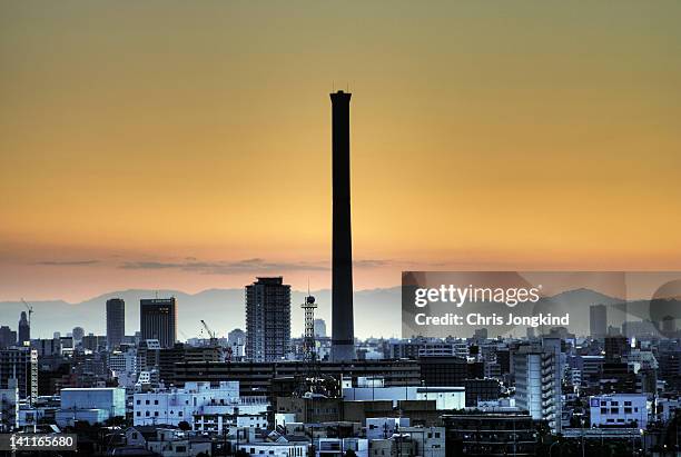 sunset over garbage incinerator in tokyo - incinerator fotografías e imágenes de stock