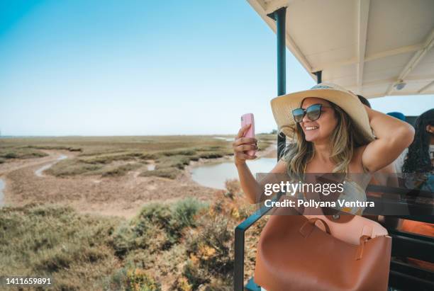 tourism at praia do barril in tavira, portugal - tavira stock pictures, royalty-free photos & images